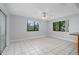 Dining room with tile flooring, ceiling fan, and many windows at 2211 Brian Ave, South Daytona, FL 32119