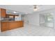 Open dining room with tile flooring next to a kitchen area at 2211 Brian Ave, South Daytona, FL 32119