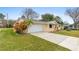 Charming one-story home with a well-manicured lawn and attached two car garage at 2211 Brian Ave, South Daytona, FL 32119