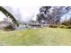 Expansive backyard features a screened pool and plenty of green space at 2307 Needle Palm Dr, Edgewater, FL 32141