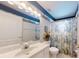 Bathroom showcasing vanity and toilet with patterned shower curtain adding style at 2307 Needle Palm Dr, Edgewater, FL 32141
