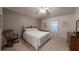 Calming bedroom with carpet, a wrought iron bed frame, and soft natural light at 2307 Needle Palm Dr, Edgewater, FL 32141