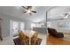 Bright dining area with seating for six and a view of the backyard at 2307 Needle Palm Dr, Edgewater, FL 32141