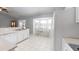 Bright kitchen featuring tile floors, a cozy breakfast nook, and white cabinetry with dark trim at 2307 Needle Palm Dr, Edgewater, FL 32141