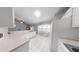 Well-lit kitchen with ample countertop space, white appliances, and casual dining area at 2307 Needle Palm Dr, Edgewater, FL 32141