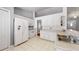 Functional kitchen equipped with white appliances, tile flooring, and ample cabinet space at 2307 Needle Palm Dr, Edgewater, FL 32141