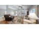 Cozy living room featuring vaulted ceiling, plush seating, and a decorative accent rug at 2307 Needle Palm Dr, Edgewater, FL 32141