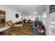 Bright sunroom filled with an assortment of furniture, rugs, and decor at 2307 Needle Palm Dr, Edgewater, FL 32141