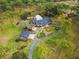 Aerial view of an estate with sprawling grounds, mature trees, and meticulously landscaped gardens at 2333 Southern Pines Pl, Deland, FL 32724
