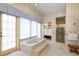 Relaxing bathroom features a large soaking tub, walk-in shower, and stylish fixtures at 2333 Southern Pines Pl, Deland, FL 32724