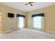 Bedroom with two large windows, carpet, and a ceiling fan at 2333 Southern Pines Pl, Deland, FL 32724
