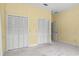 Neutral bedroom with two large closets for plenty of storage at 2333 Southern Pines Pl, Deland, FL 32724