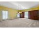 Open bedroom with built in cabinets, neutral walls and large windows for natural light at 2333 Southern Pines Pl, Deland, FL 32724