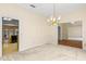 Dining area with traditional chandelier and easy access to the kitchen and other living spaces at 2333 Southern Pines Pl, Deland, FL 32724