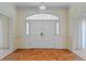 Elegant front entrance with arched, paneled double doors and decorative transom window at 2333 Southern Pines Pl, Deland, FL 32724