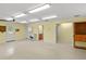 The yellow painted garage has a utility sink, access to the backyard, and lots of lighting at 2333 Southern Pines Pl, Deland, FL 32724