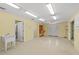 The expansive garage area has a utility sink, lots of bright lights, and neutral flooring at 2333 Southern Pines Pl, Deland, FL 32724