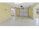 Bright and spacious garage with ample room for vehicles, storage and projects at 2333 Southern Pines Pl, Deland, FL 32724