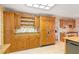 Well-lit kitchen with light-toned cabinets, granite countertops, and modern appliances for a functional cooking space at 2333 Southern Pines Pl, Deland, FL 32724