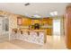 Spacious kitchen area with tile flooring and classic wood cabinetry at 2333 Southern Pines Pl, Deland, FL 32724