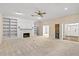 Large living room with built-ins, fireplace, and multiple doorways at 2333 Southern Pines Pl, Deland, FL 32724