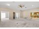 Open living room with ceiling fan and multiple doorways to other rooms at 2333 Southern Pines Pl, Deland, FL 32724