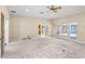 Bright living room leading to a sunroom and the kitchen at 2333 Southern Pines Pl, Deland, FL 32724