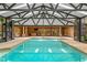 Indoor pool surrounded by large patio space at 2333 Southern Pines Pl, Deland, FL 32724