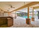 Covered outdoor space with brick columns, outdoor bar, and pool at 2333 Southern Pines Pl, Deland, FL 32724