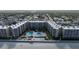 Aerial view of oceanfront condos with multiple pools at 2401 S Atlantic Ave # A604, New Smyrna Beach, FL 32169