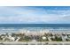 Aerial view of beachfront condo with parking, palm trees, and easy access to the ocean at 2401 S Atlantic Ave # A604, New Smyrna Beach, FL 32169