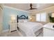 Charming bedroom with ocean-inspired accents, soft lighting, and a comfortable queen-sized bed at 2401 S Atlantic Ave # A604, New Smyrna Beach, FL 32169