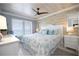 Serene bedroom with wood-look ceiling, ocean view, coastal decor, and comfortable furnishings at 2401 S Atlantic Ave # A604, New Smyrna Beach, FL 32169