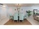 Coastal dining room features a chandelier, dining table with seating for six at 2401 S Atlantic Ave # A604, New Smyrna Beach, FL 32169
