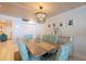 Dining room with seating for six, chandelier and view of the entry at 2401 S Atlantic Ave # A604, New Smyrna Beach, FL 32169