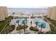 Beautiful pools with ample lounge seating surrounded by tropical landscaping and ocean views at 2401 S Atlantic Ave # A604, New Smyrna Beach, FL 32169