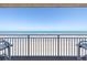 Breathtaking oceanfront view from the balcony, showcasing the beach and horizon beyond railing at 2401 S Atlantic Ave # D301, New Smyrna Beach, FL 32169
