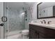 Updated bathroom featuring a glass-enclosed shower, modern fixtures, and a sleek vanity at 2401 S Atlantic Ave # D301, New Smyrna Beach, FL 32169
