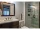 Modern bathroom featuring a walk-in shower, stylish fixtures, and a well-lit vanity area at 2401 S Atlantic Ave # D301, New Smyrna Beach, FL 32169