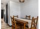 A cozy dining room features a wooden table set and ample natural light at 2401 S Atlantic Ave # D301, New Smyrna Beach, FL 32169