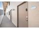 Exterior corridor of the condominium showing unit doors and building architecture at 2401 S Atlantic Ave # D301, New Smyrna Beach, FL 32169