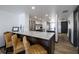 Kitchen with wood accents, stainless steel appliances, and a marble countertop at 2401 S Atlantic Ave # D301, New Smyrna Beach, FL 32169