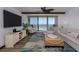 Comfortable living room with a large window view of the ocean and a cozy seating area at 2401 S Atlantic Ave # D301, New Smyrna Beach, FL 32169