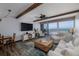Bright living room featuring exposed beams, ocean view, and stylish decor at 2401 S Atlantic Ave # D301, New Smyrna Beach, FL 32169