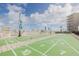 Bright shuffleboard court provides engaging entertainment for residents with lounge chairs to relax at 2401 S Atlantic Ave # D301, New Smyrna Beach, FL 32169
