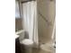 Bathroom with tiled shower and neutral-toned walls and white accents at 2409 Victory Palm Dr, Edgewater, FL 32141
