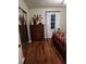 Cozy bedroom with wood floors, a decorative dresser, and a metal-frame bed at 2409 Victory Palm Dr, Edgewater, FL 32141