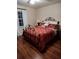 Charming bedroom with decorative wrought iron bed frame and matching paisley bedding at 2409 Victory Palm Dr, Edgewater, FL 32141
