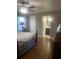 Primary bedroom features a ceiling fan and a view to the ensuite bathroom at 2409 Victory Palm Dr, Edgewater, FL 32141