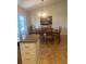Well-lit dining area with tiled floors, a wooden table, and a view to the backyard at 2409 Victory Palm Dr, Edgewater, FL 32141